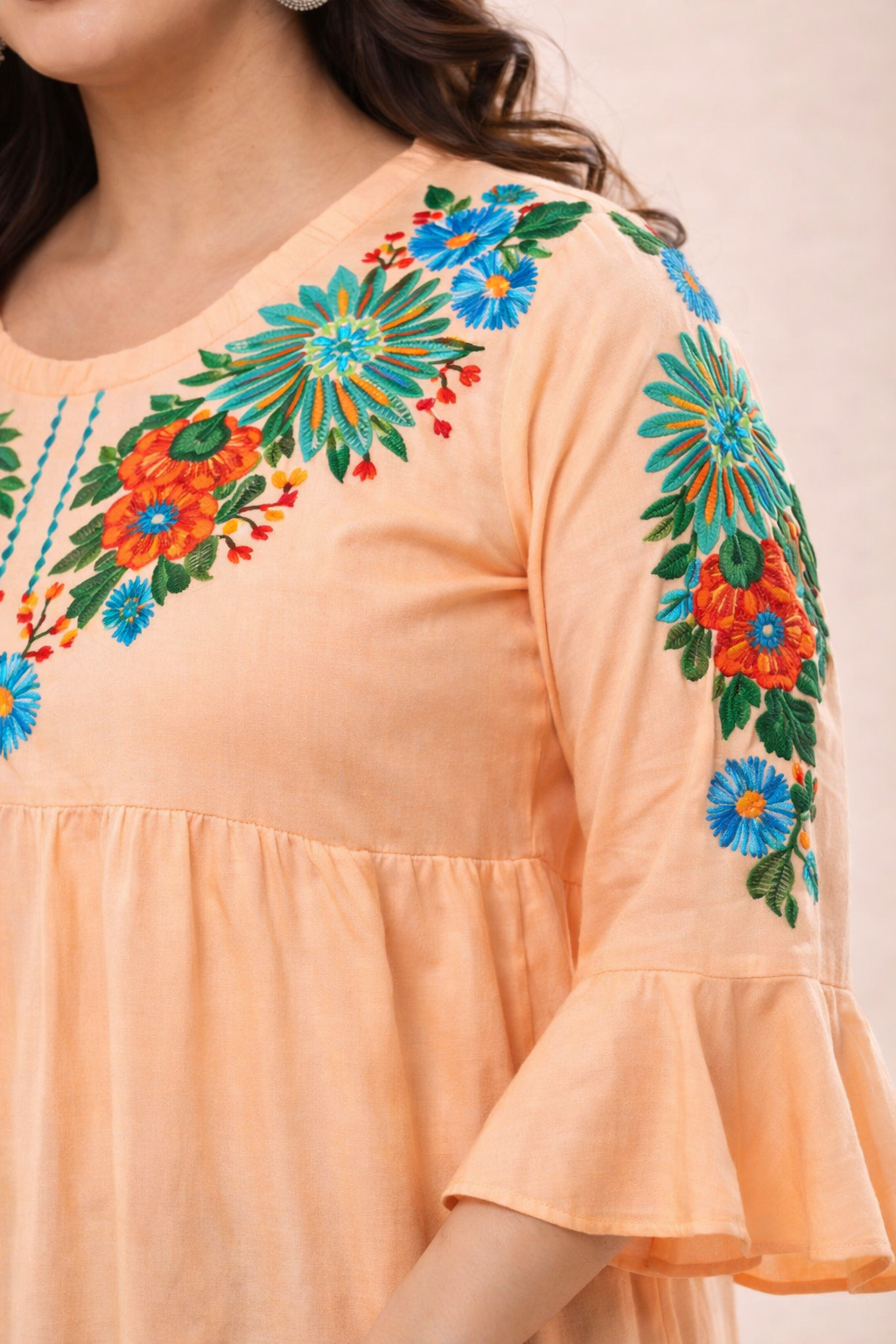 Peach Floral Embroidered Tiered Peplum Top | Vaamii